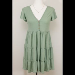 3-tier dress in soft green.